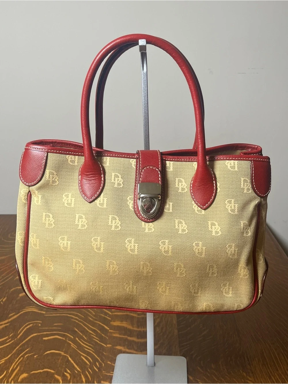Dooney & Bourke Tan Monogram Canvas Satchel with Red Leather Trim Silver Lock.